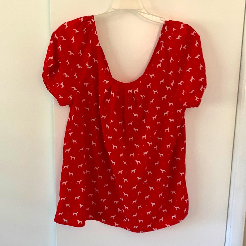 Short sleeve red blouse with white dogs. Detailed bow in back